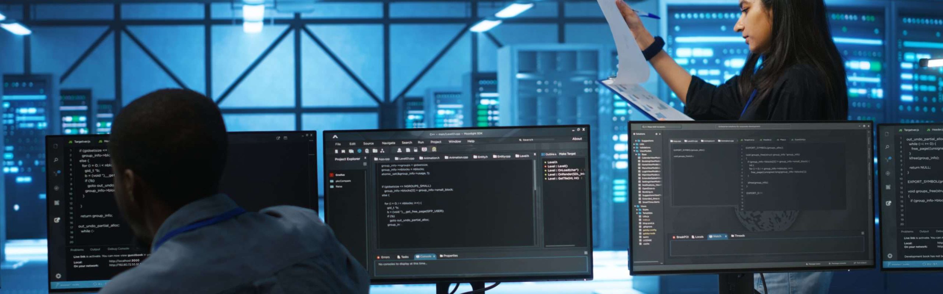Indian manager in data center doing inspection on electronics and workers, ensuring order. Team leader reading clipboard files, supervising employees in server room infrastructure components